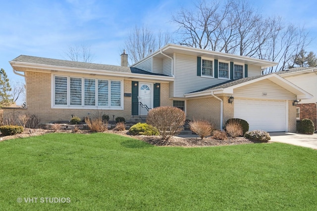 tri-level home with driveway, brick siding, an attached garage, and a front lawn