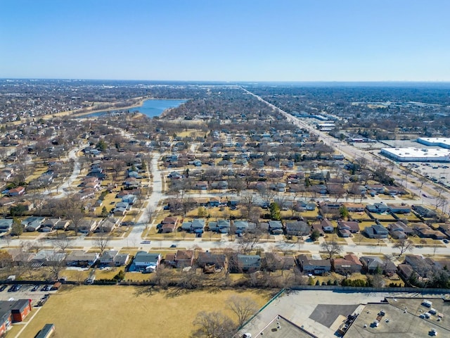 drone / aerial view featuring a residential view and a water view