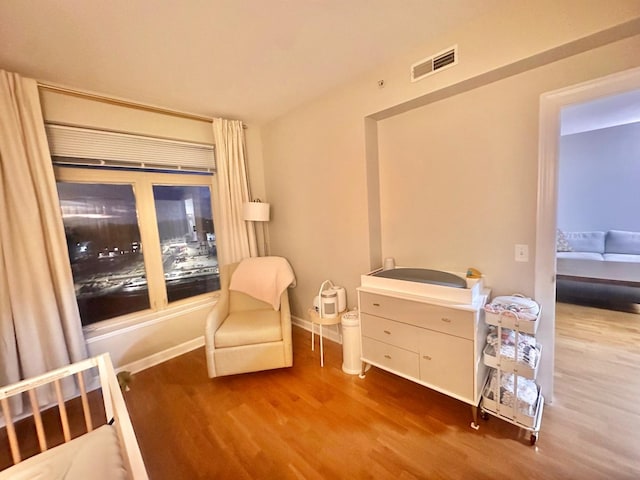 bedroom with hardwood / wood-style floors