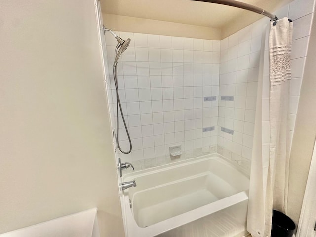 bathroom with shower / bathtub combination with curtain