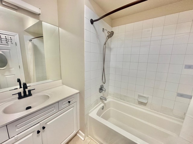 bathroom with vanity, tile patterned floors, and shower / bath combo with shower curtain