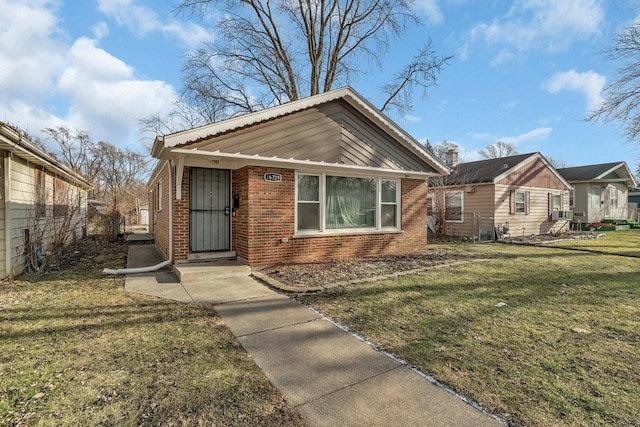 bungalow-style house featuring a front yard