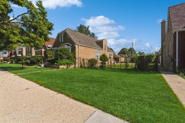 view of side of property featuring a yard