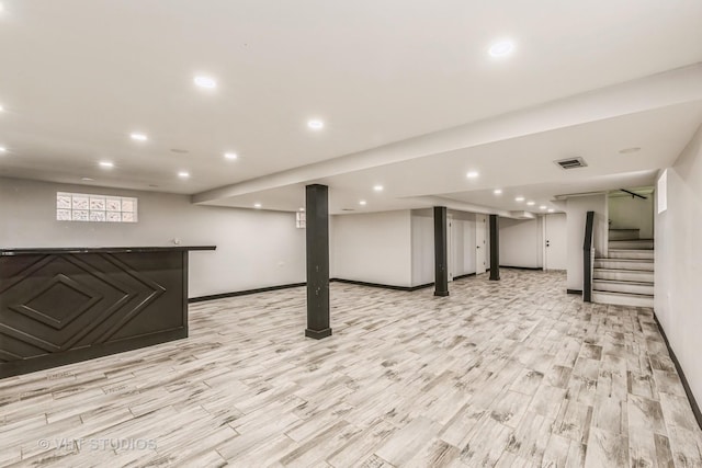 basement featuring light wood-type flooring