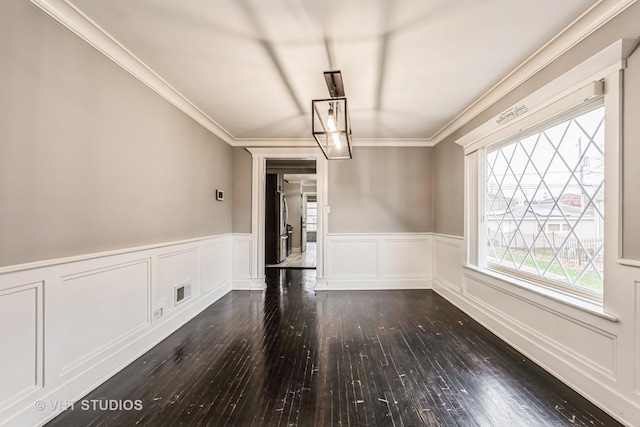 unfurnished dining area with dark wood-type flooring and ornamental molding