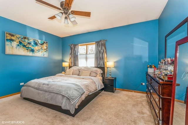 bedroom featuring ceiling fan and light colored carpet