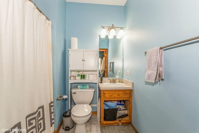 bathroom featuring tile patterned floors, vanity, and toilet