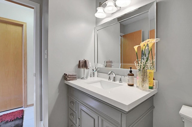 bathroom with vanity and toilet