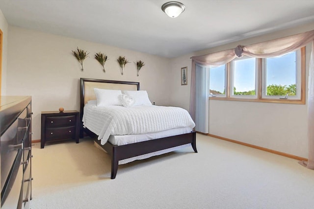 bedroom featuring light carpet