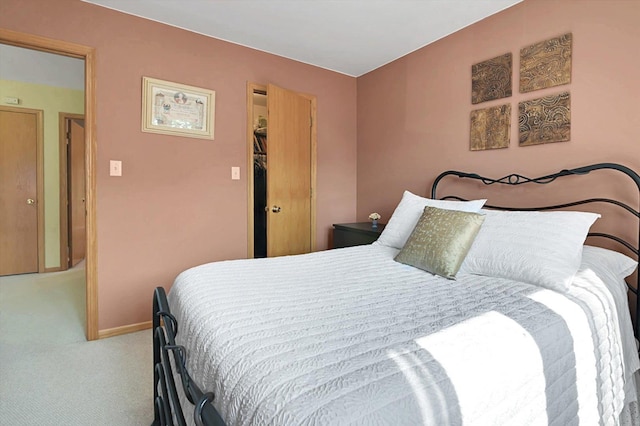 carpeted bedroom featuring a closet