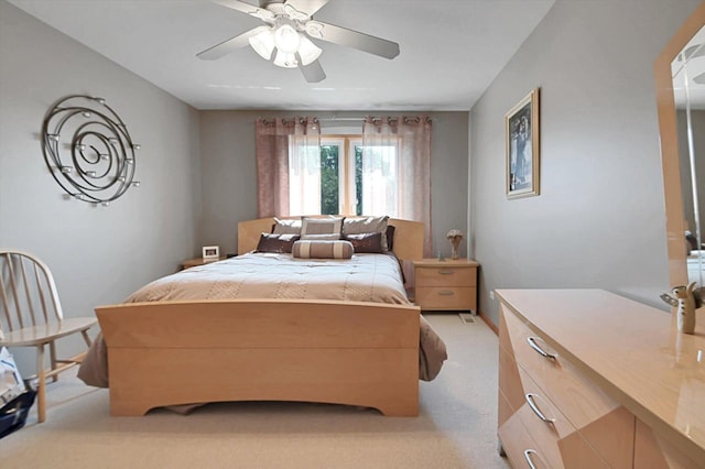 bedroom featuring light carpet and ceiling fan