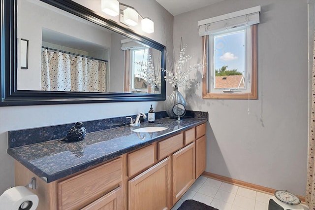 bathroom with tile patterned floors and vanity