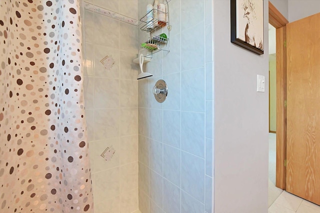 bathroom with tile patterned floors and a shower with curtain