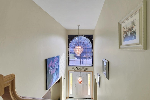 entryway featuring an inviting chandelier