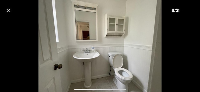 bathroom with tile patterned floors and toilet