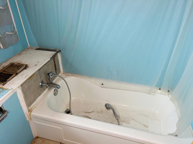 bathroom with a washtub