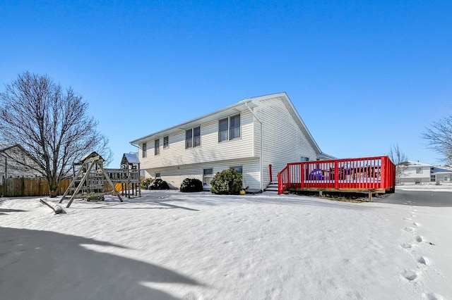 exterior space with a deck and a playground