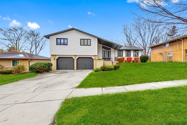 split level home with a front yard and a garage