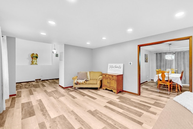 sitting room featuring light hardwood / wood-style floors