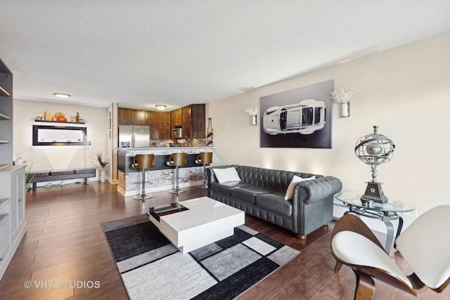 living room with dark hardwood / wood-style flooring