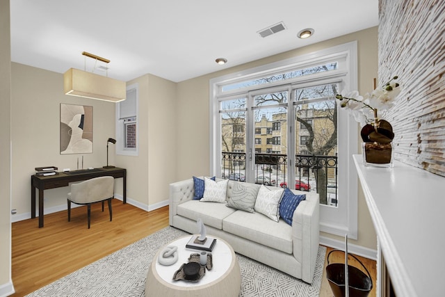 living room with light hardwood / wood-style floors