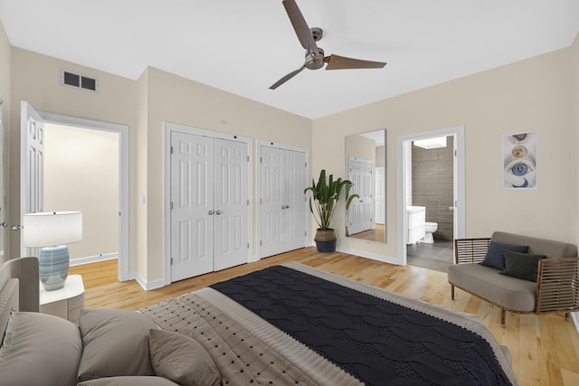 bedroom with ceiling fan, ensuite bath, french doors, and light wood-type flooring