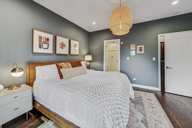 bedroom with dark wood-type flooring