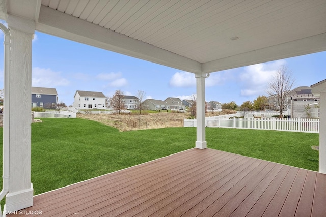 wooden terrace featuring a lawn