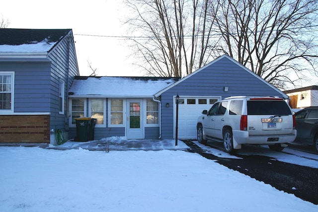 view of front of home with a garage