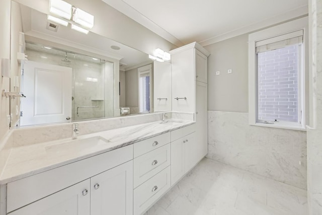 bathroom with an enclosed shower, vanity, tile walls, and crown molding