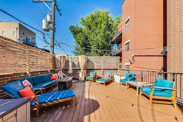 wooden deck with an outdoor hangout area