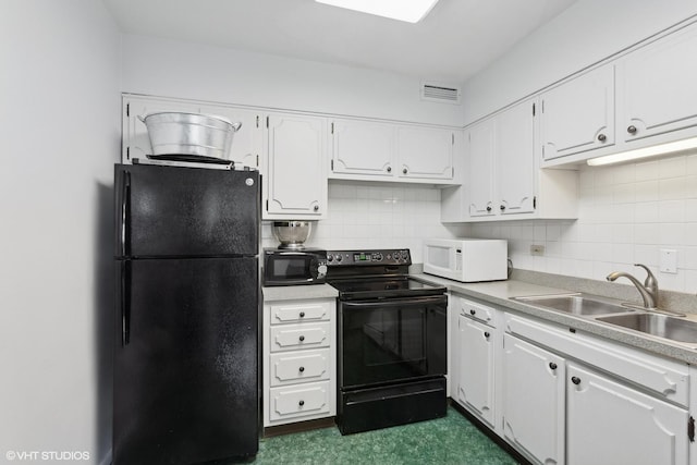 kitchen with tasteful backsplash, sink, white cabinets, and black appliances