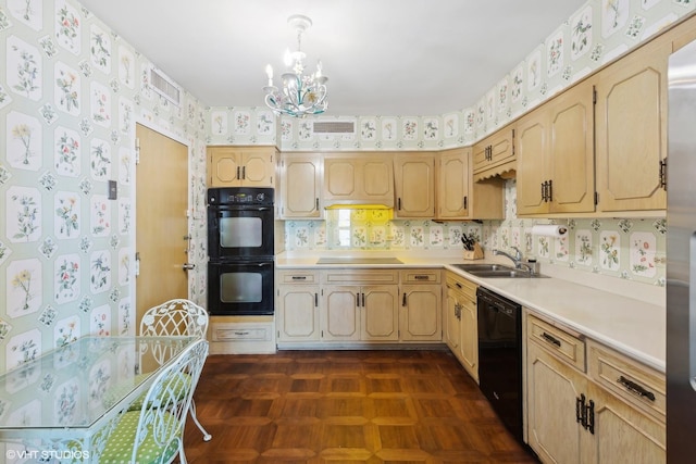 kitchen with dark parquet flooring, sink, an inviting chandelier, light brown cabinetry, and black appliances