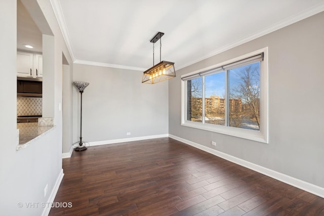 unfurnished dining area featuring dark wood-type flooring and ornamental molding