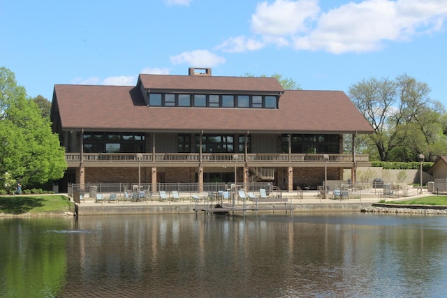 back of house featuring a water view