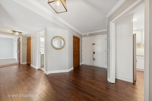 entrance foyer with crown molding and dark wood-type flooring