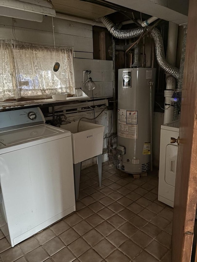 laundry room with washer / clothes dryer, tile patterned floors, and water heater