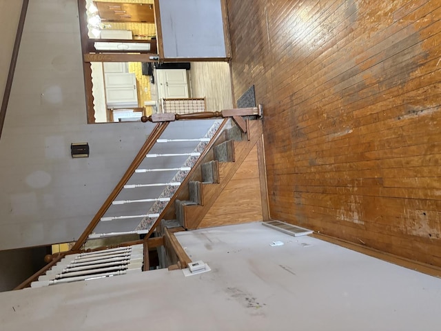 staircase with wooden walls