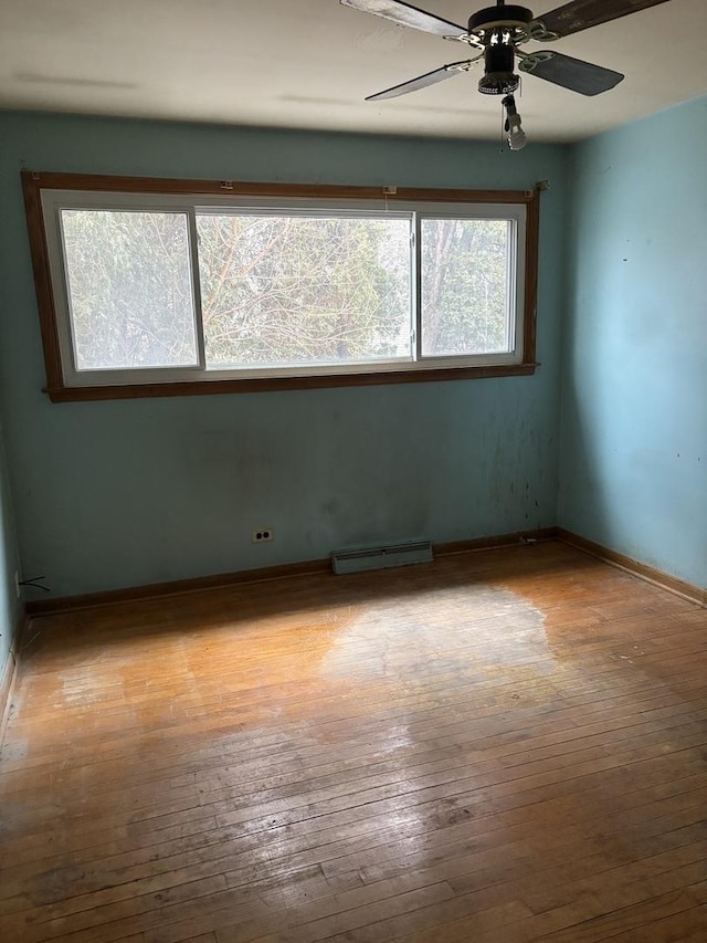 spare room with light hardwood / wood-style floors and ceiling fan