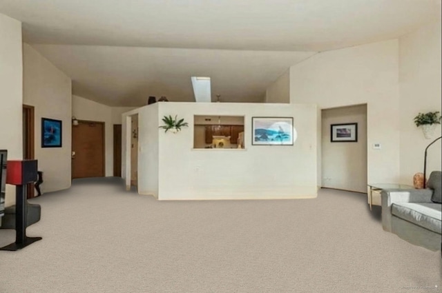 carpeted living room with lofted ceiling