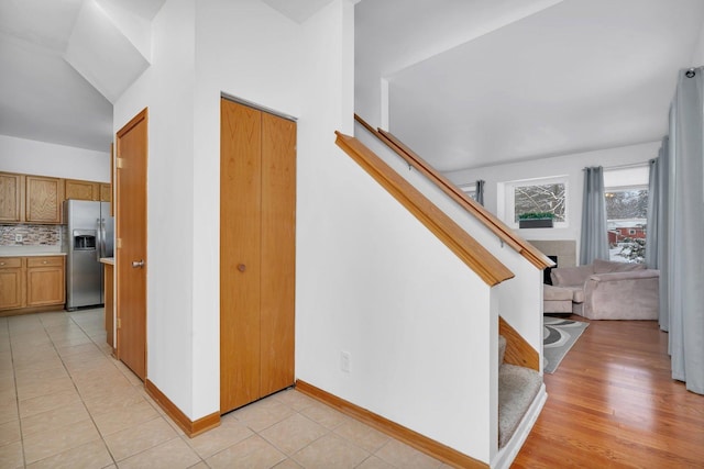 stairs featuring tile patterned flooring