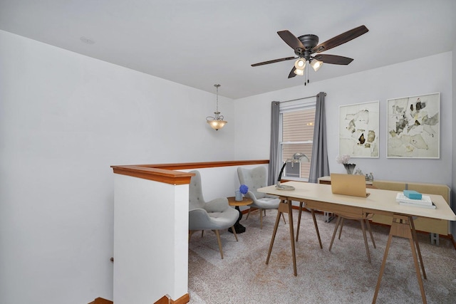 carpeted home office with ceiling fan