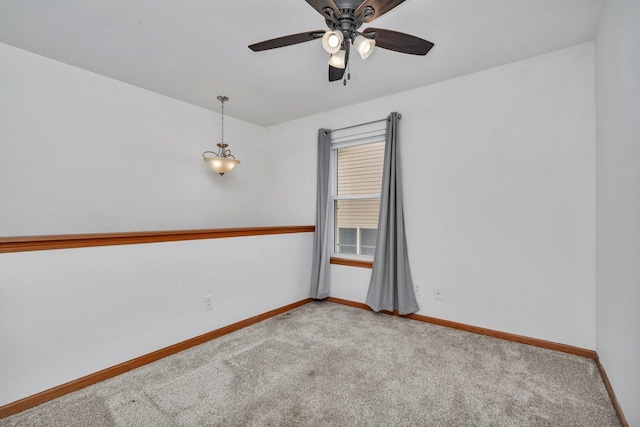 empty room with light carpet and ceiling fan