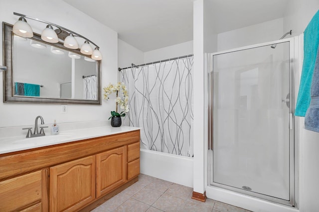 bathroom featuring tile patterned flooring, vanity, and walk in shower