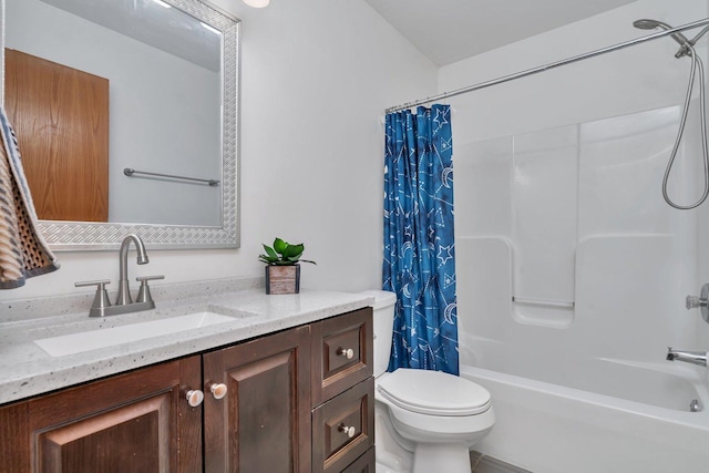 full bathroom featuring shower / bath combination with curtain, vanity, and toilet