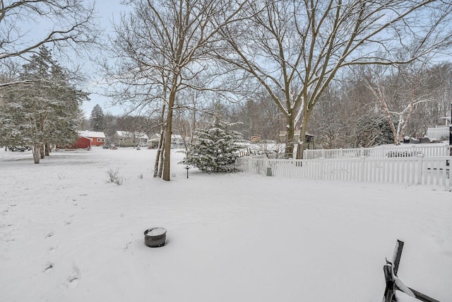 view of yard layered in snow