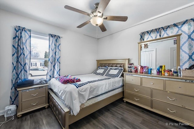 bedroom featuring ceiling fan and dark hardwood / wood-style floors