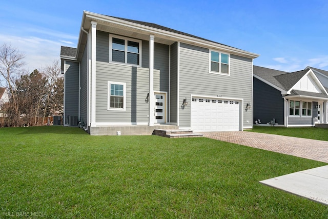 view of front of property featuring central AC, a front yard, and a garage