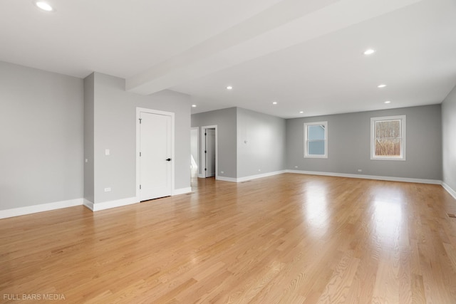 spare room with light hardwood / wood-style floors