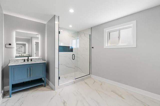 bathroom featuring a healthy amount of sunlight, vanity, and a shower with shower door